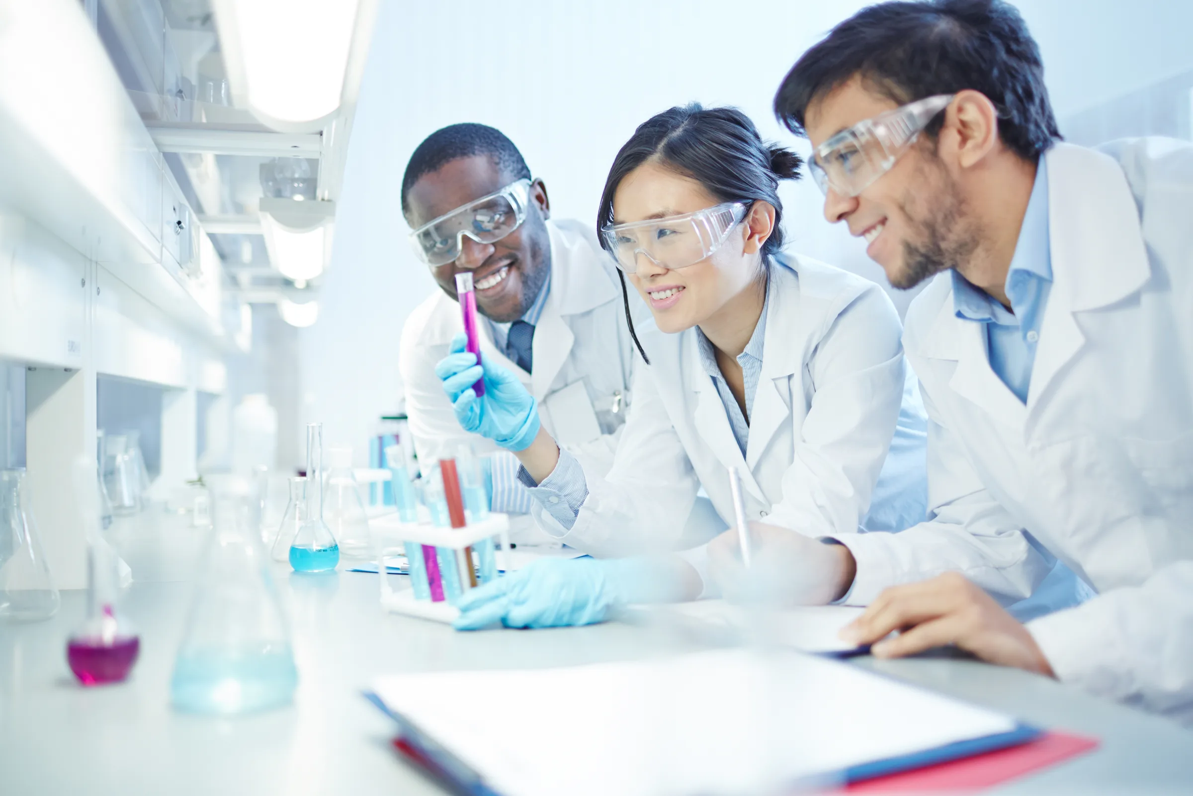 Researchers collaborating in a bright laboratory